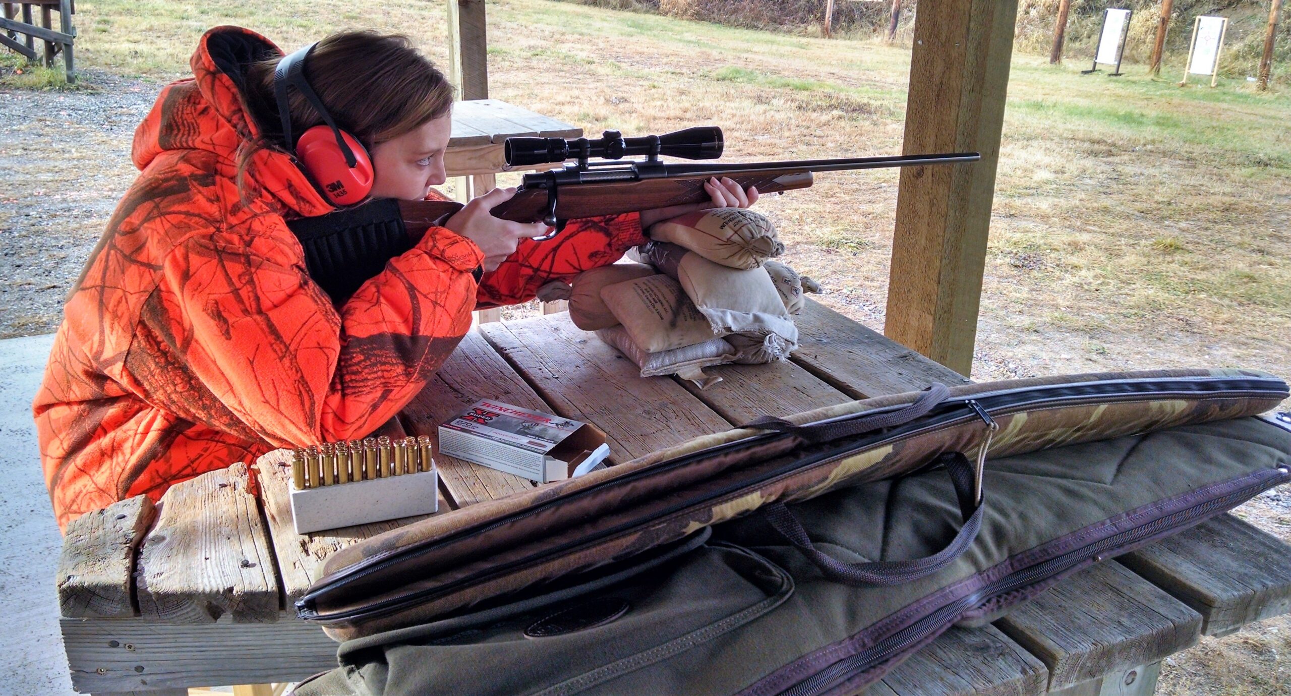 Woman at the rifle range Lakes Area Shooting Sports